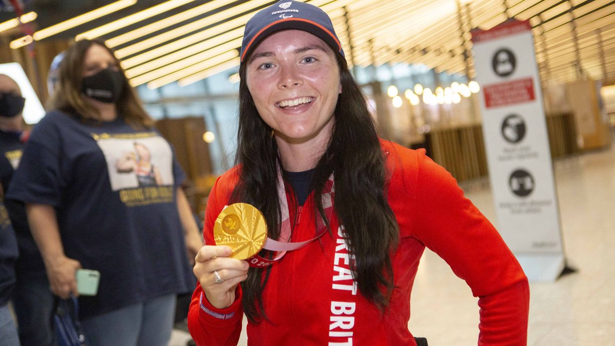Gold medalist Lauren Rowles arrives back at London Heathrow (Rick Findler/PA)