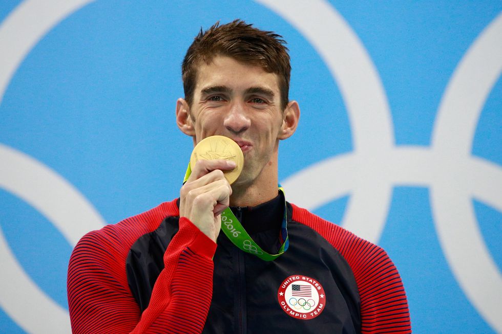 Gold medalist Michael Phelps of the United States celebrates on the podium during the medal ceremony for the Men's 200m Individual Medley Final on Day 6 of the Rio 2016 Olympic Game