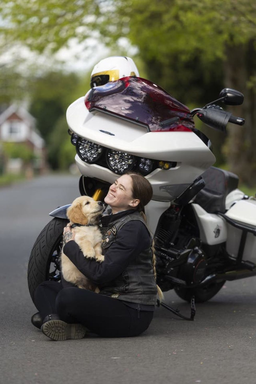 Golden retriever puppy Kian meets Harley-Davidson rider Emma Poole, as the charity Guide Dogs appeals for more motorbike riders to volunteer as puppy raisers