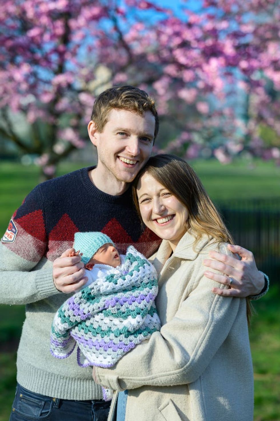 Grace and Angus Davidson with Amy under blossom trees