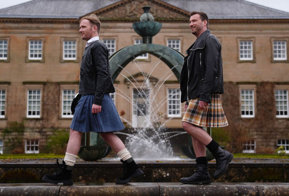 Graeme Bone (left), and Jai McDowell wearing kilts