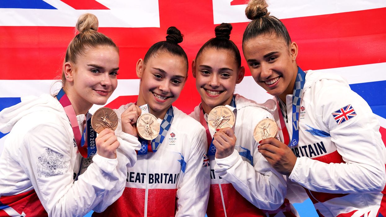 Great Britain’s Alice Kinsella, Jennifer Gadirova, Jessica Gadirova and Amelie Morgan celebrate with their bronze medals (Martin Rickett/PA)