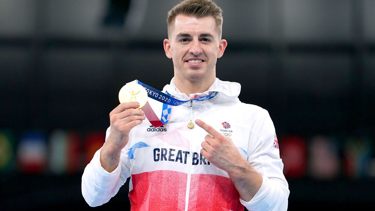 Great Britain’s Max Whitlock celebrates with his gold medal after winning the men’s pommel horse final in Tokyo (Mike Egerton/PA)