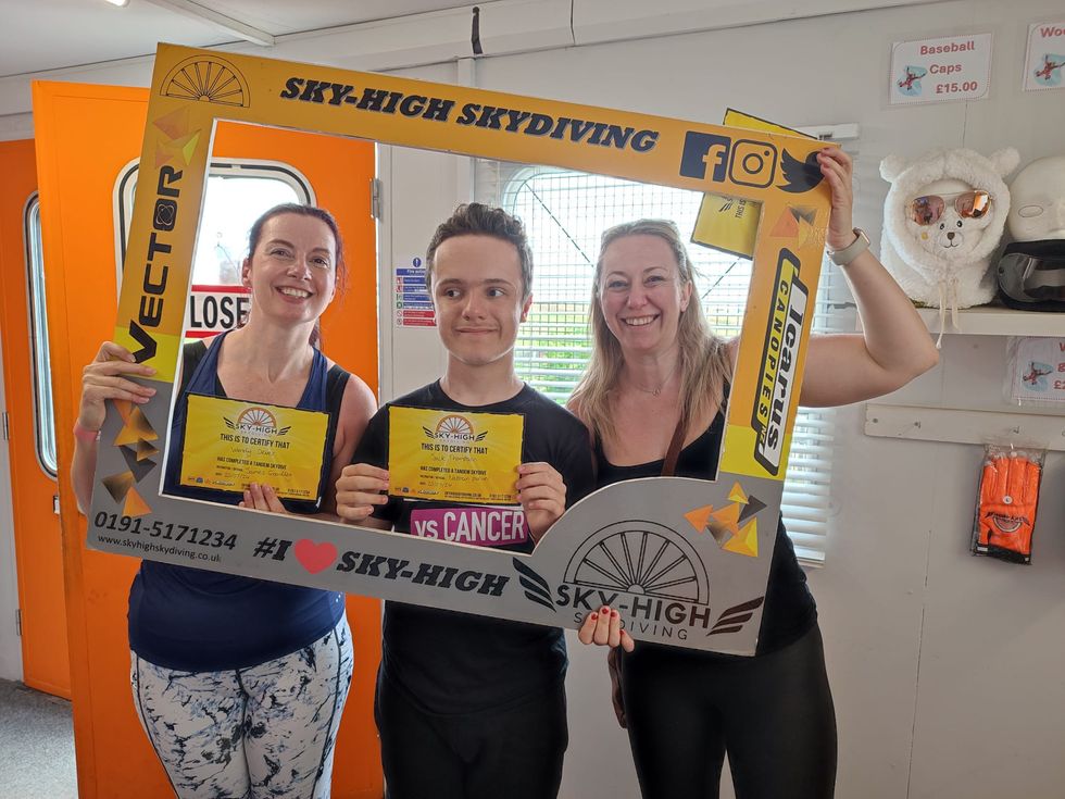 Group of three people, including Jack Thompson, posing together