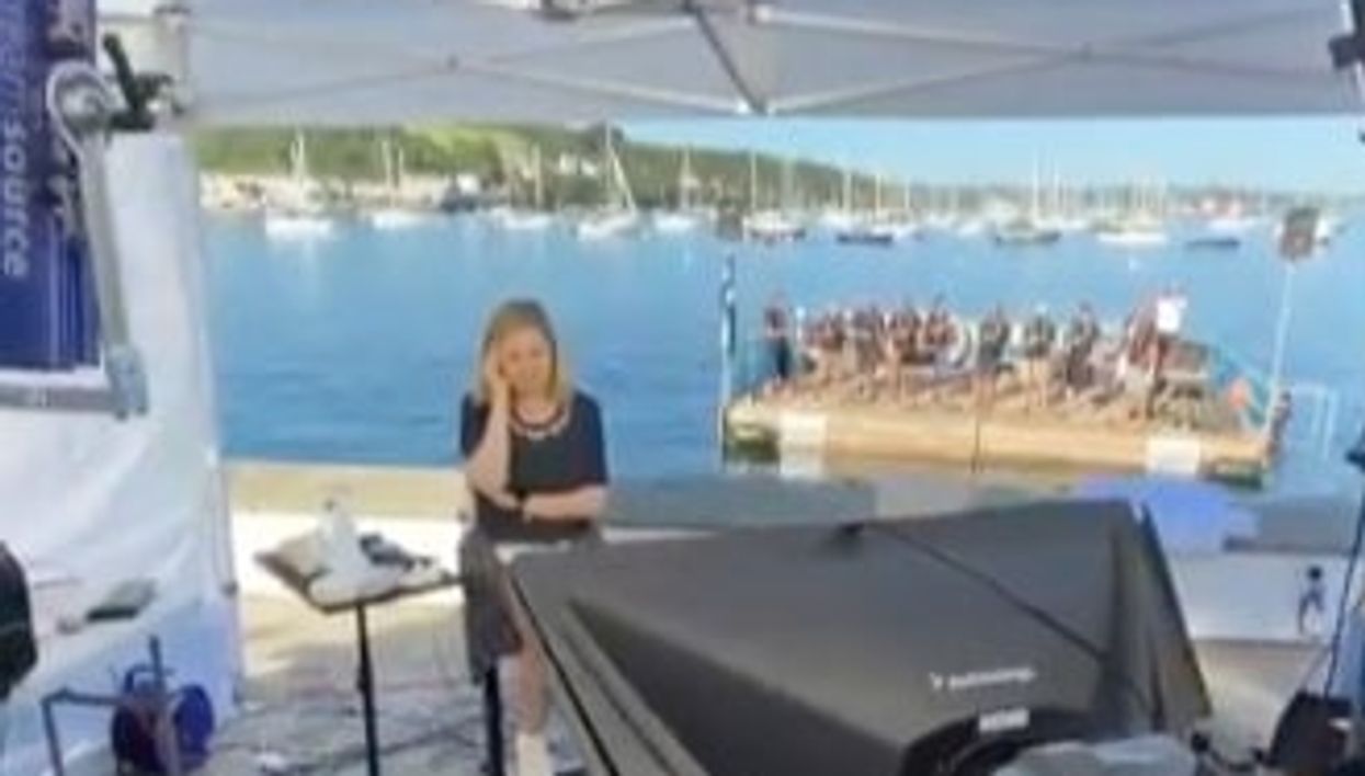 <p>Hala Gorani was hosting from Cornwall at the end of the G7 summit while the all-male choir sang metres away from her</p>