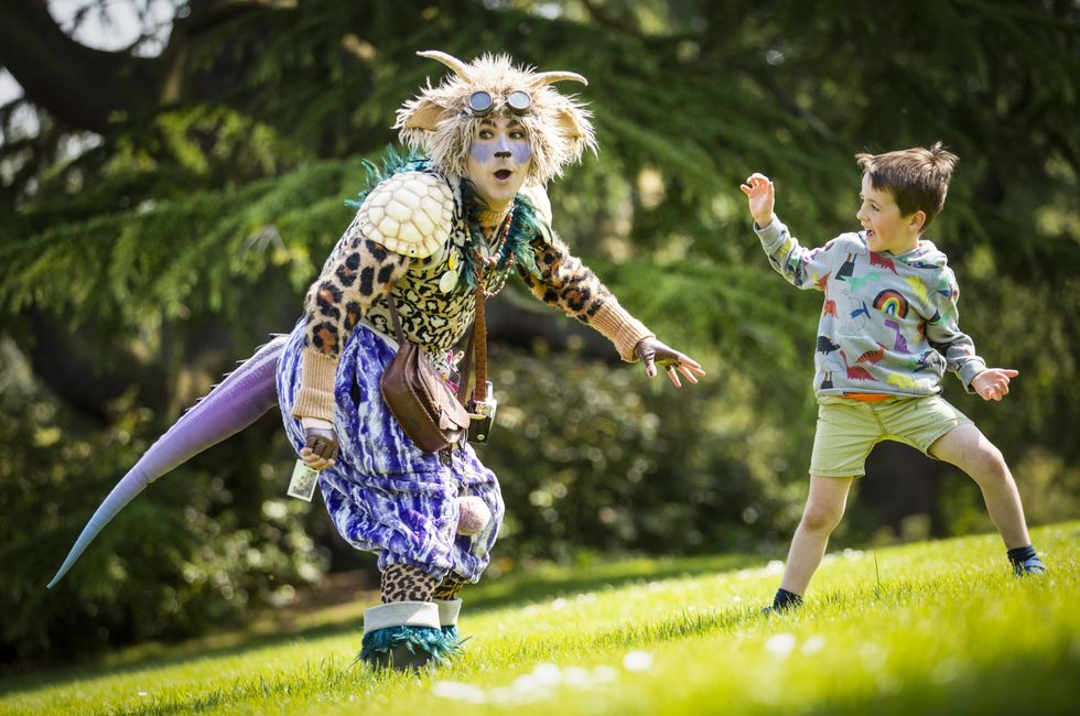 Hamish Lamont, aged five, meets 'The Undiscovered Creature' during a performance at the Royal Botanic Garden Edinburgh for the 2021 Edinburgh International Children\u2019s Festival
