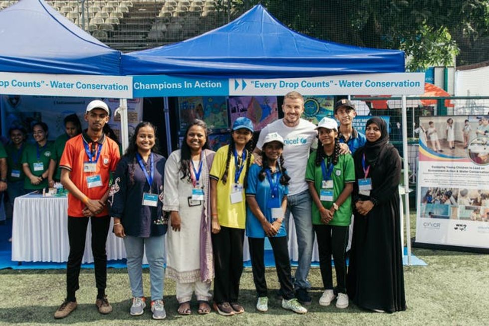 Handout photo issued by Unicef of their Goodwill Ambassador Sir David Beckham with children from underserved communities who have been trained in football and life skills by the Oscar Foundation, at the Cooperage Football Grounds in Mumbai during his second visit to India with Unicef