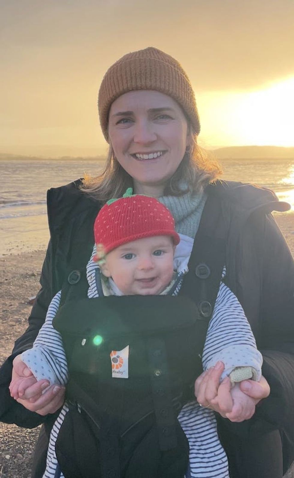 Hannah Robinson holding their child