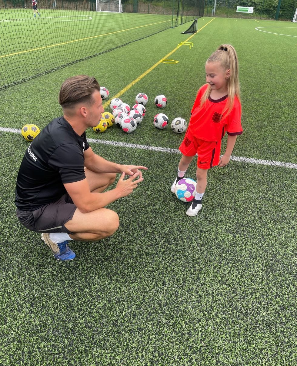 Harper Mills with her coach Connor Mooney at training.