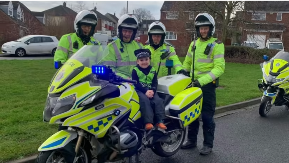 Boy, five, whose father died last year leads police on unique motorcycle ride