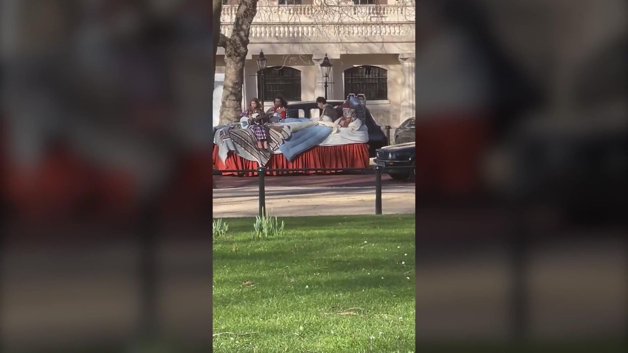 Harry Styles films on giant bed for music video outside Buckingham Palace