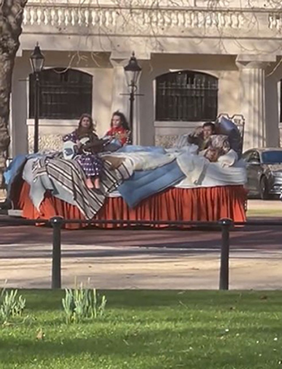 Harry Styles spotted filming in large bed in front of Buckingham Palace