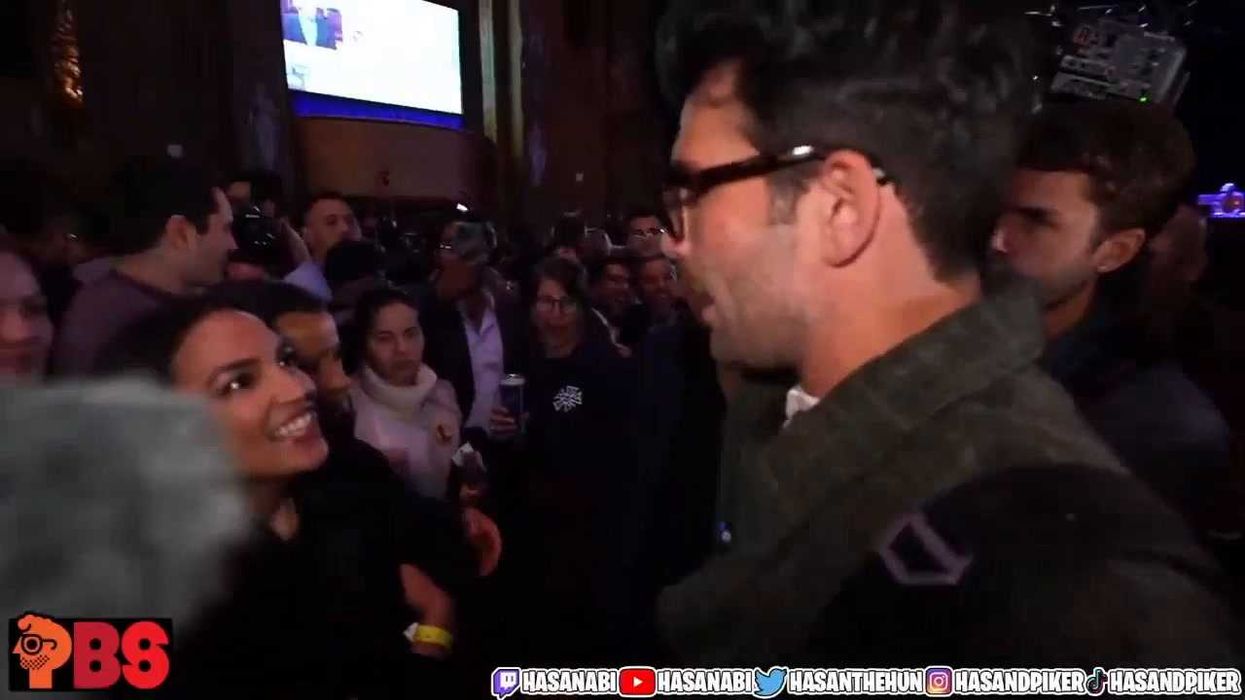 Hasan Piker hugs Rep. Alexandria Ocasio-Cortez at the Zohran Mamdani victory party