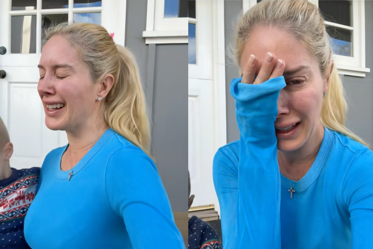 Heidi Montag cries over the loss of her home. She is wearing a blue shirt and has her hair up in a ponytail