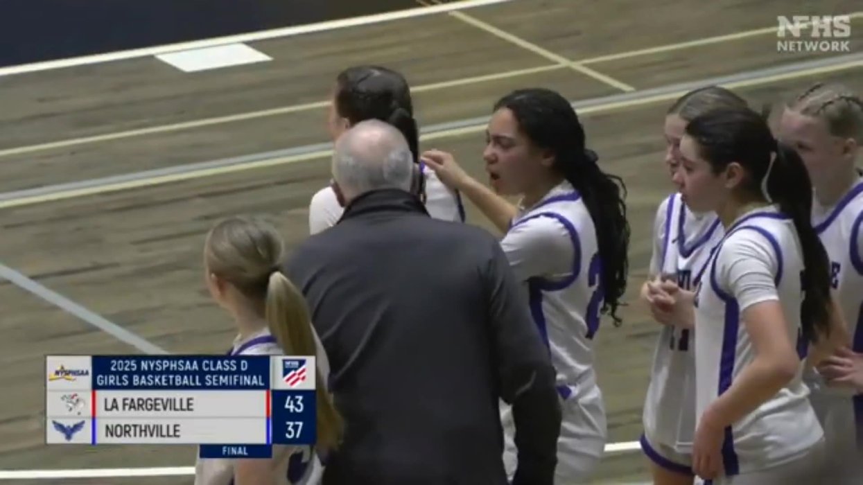 Fired high school basketball coach apologises for yanking female player