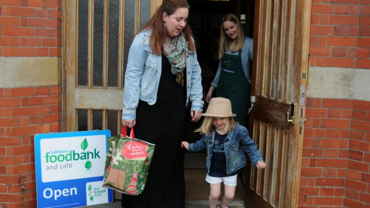 Holly Jones, 29, and her five-year-old daughter Phoebe getting help at a food bank in Chichester, Sussex