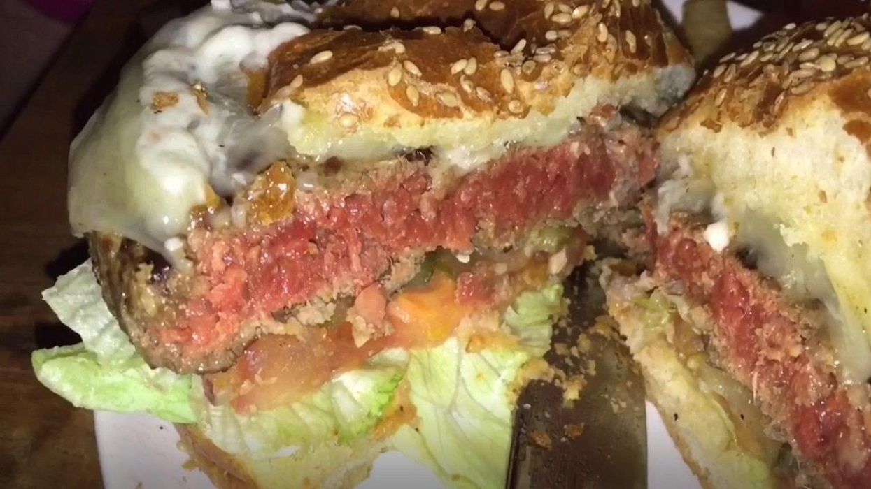 Customer brings his own cheese to put on his Checkers burger to save money