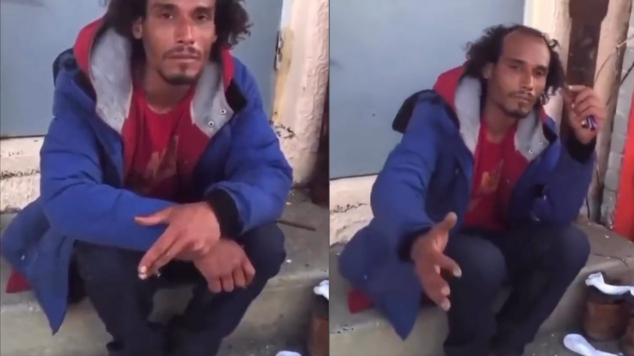 Homeless man being filmed