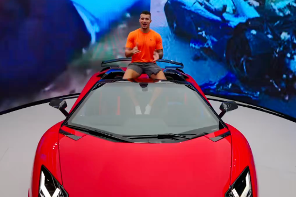 HSTikkyTokky poses on top of his new red Lamborghini