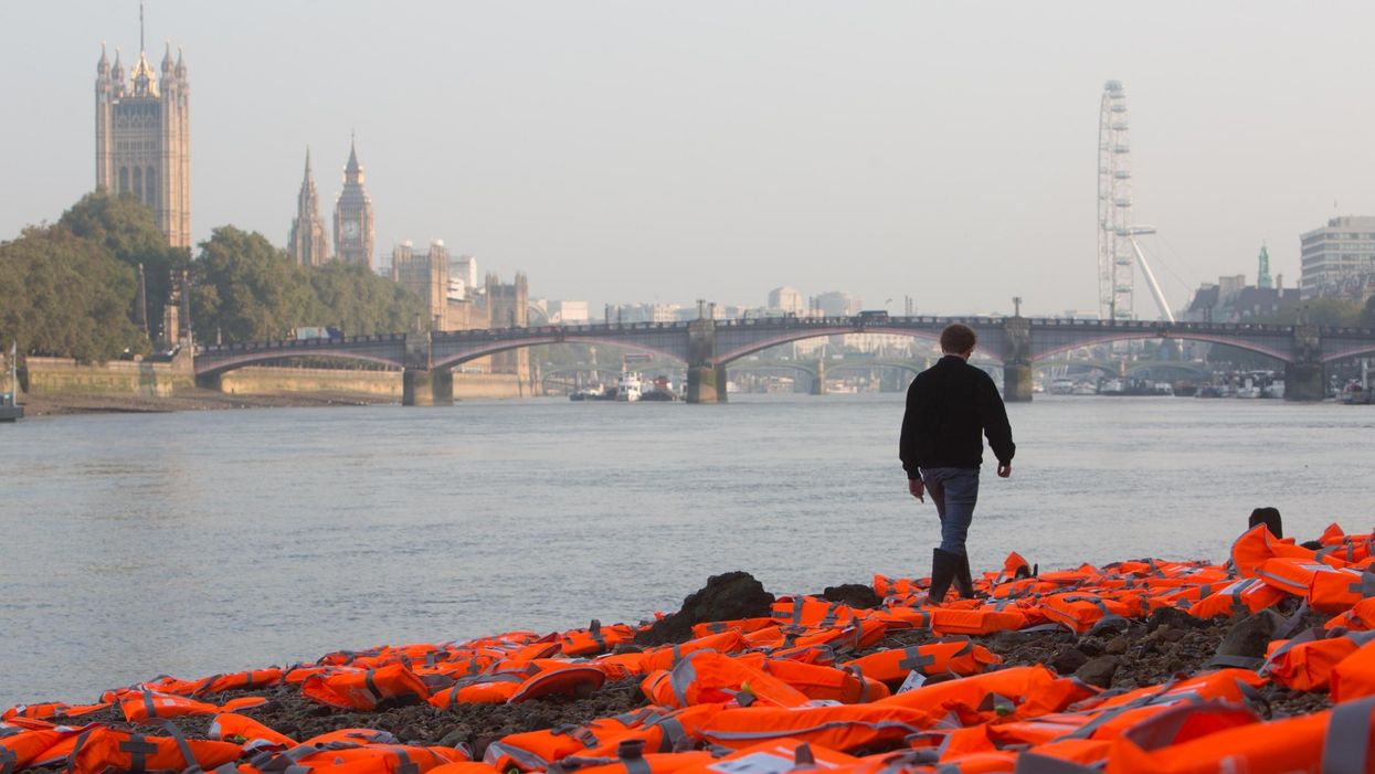 Hundreds of life jackets lie on bank of Thames. Picture: