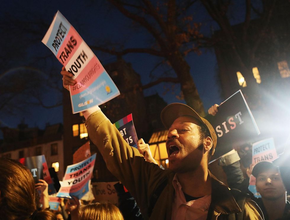 Hundreds protest a Trump administration announcement that rescinds an Obama-era order allowing transgender students to use school bathrooms matching their gender identities
