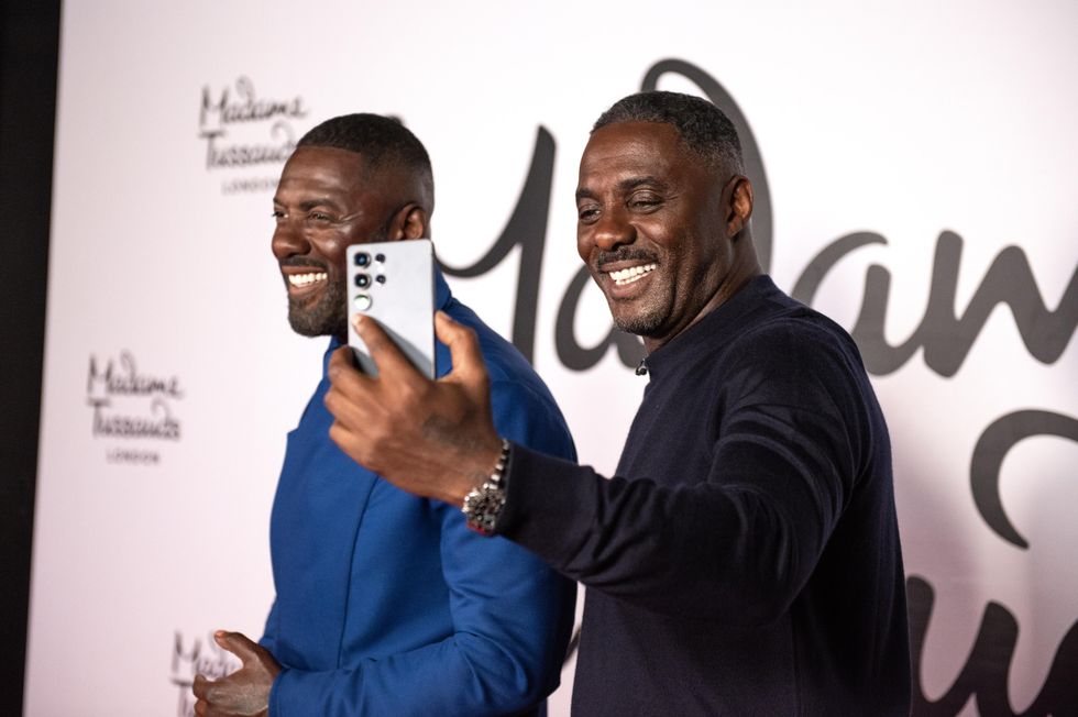 Idris Elba taking a selfie with his waxwork at Madame Tussauds London