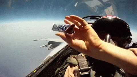 This is how you pass snacks in a fighter jet