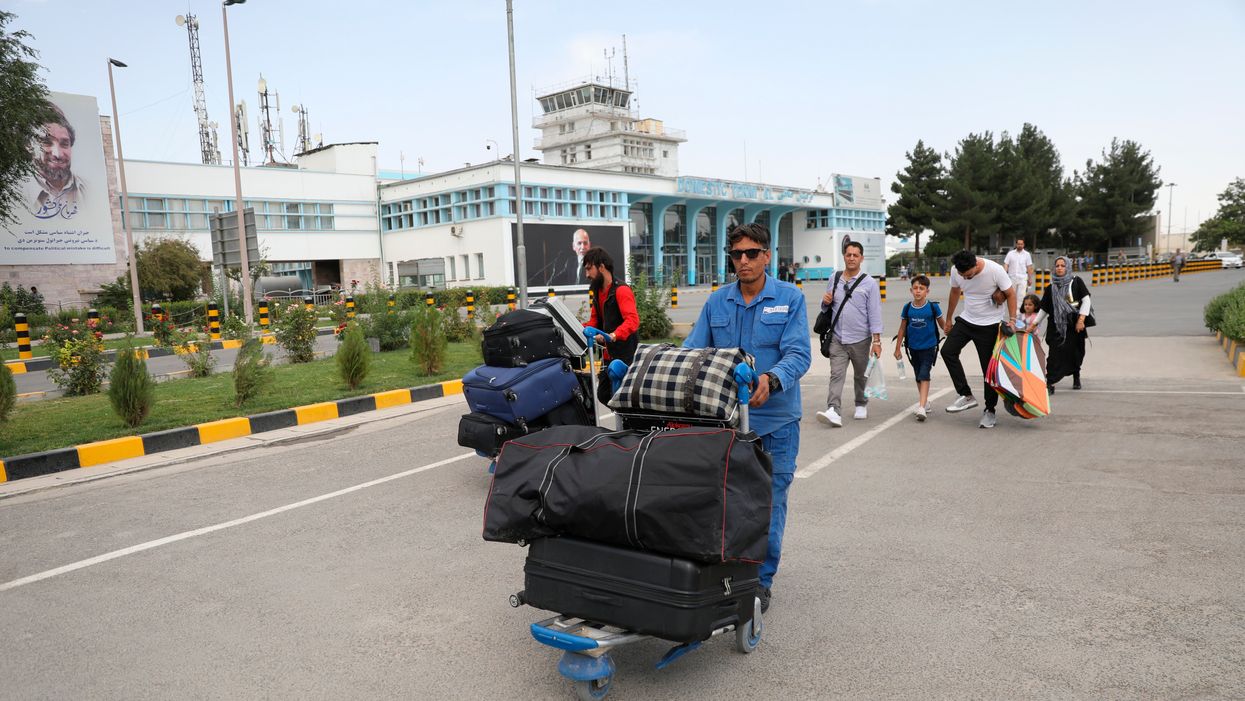 Chaos in Kabul as Afghans and foreigners try to flee after Taliban takes control – in pictures
