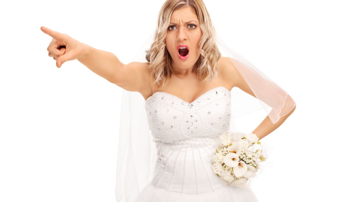 Bride angry after she spots groom watching rugby on his phone at their own wedding