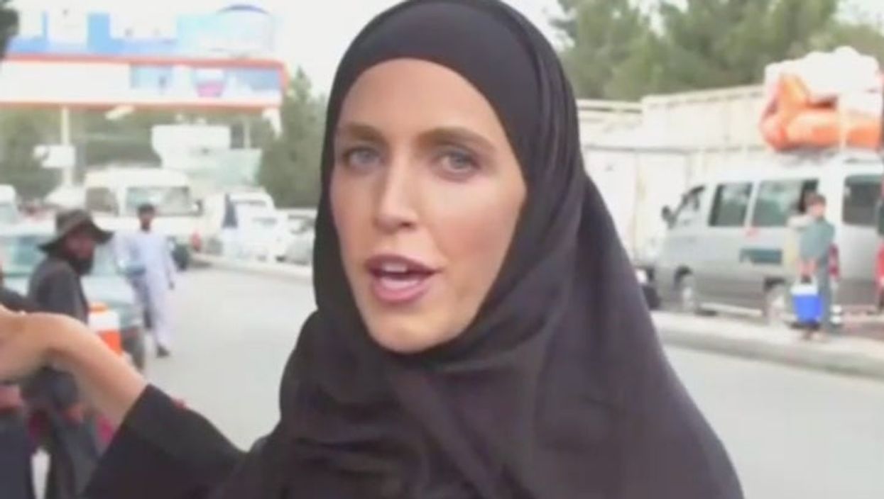 Amazing video shows TV reporter keeping cool during live broadcast despite gunfire behind her