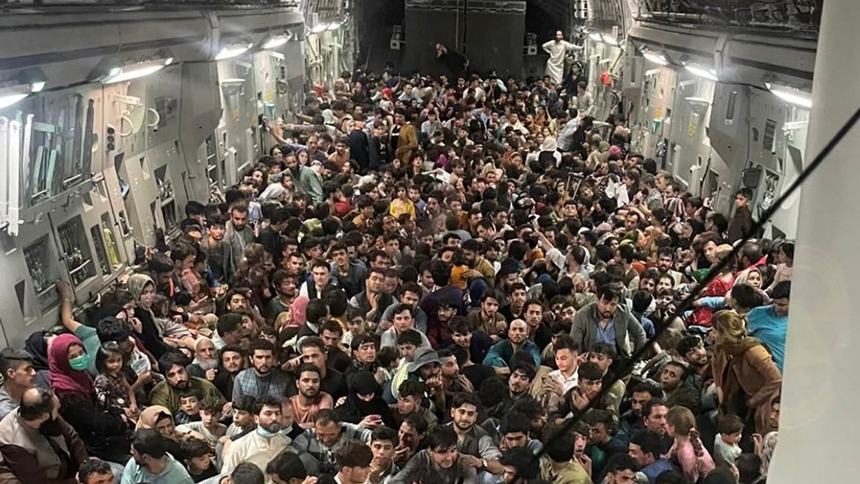 Stark picture shows hundreds of Afghans crammed into US plane as they try to flee Kabul