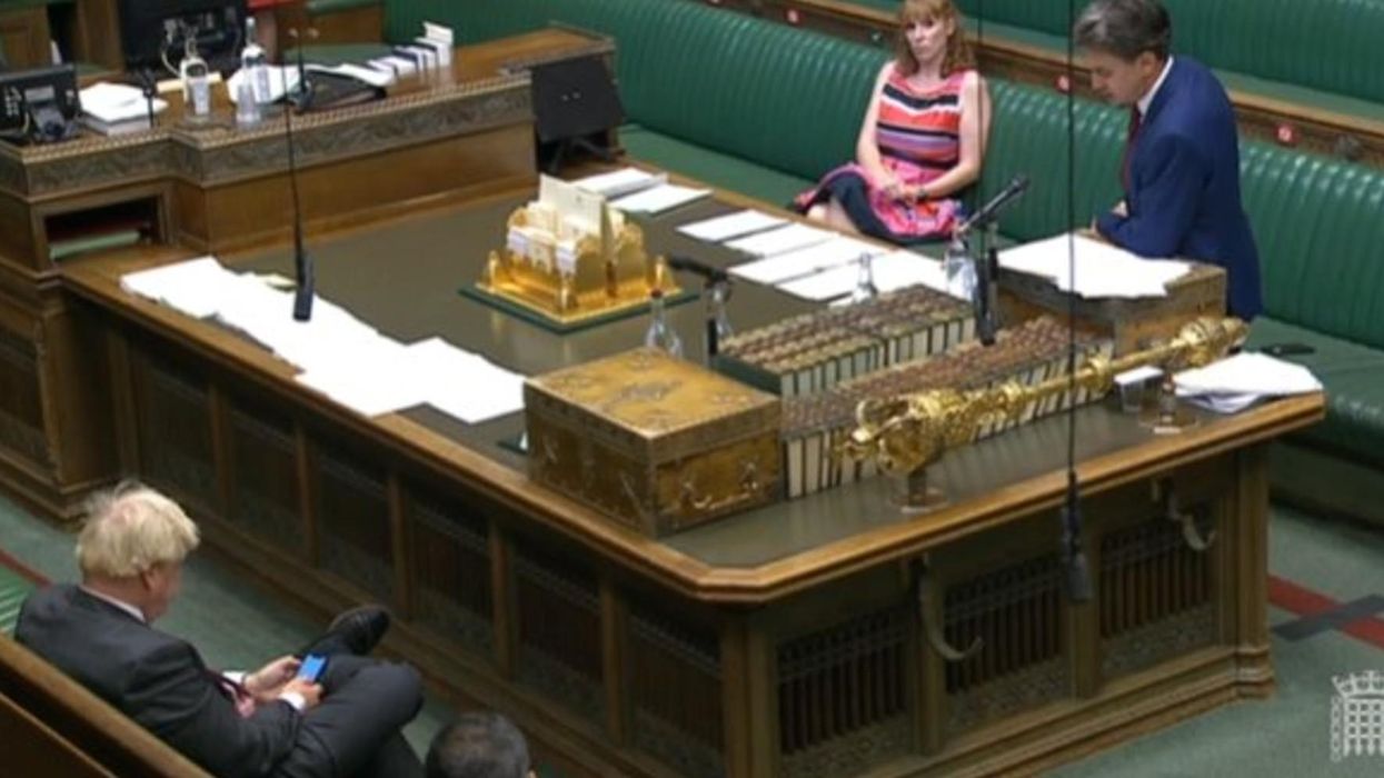 Outrage as Boris Johnson caught checking phone during parliament debate