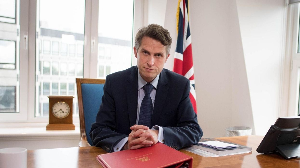 Gavin Williamson ridiculed for posing with a 'whip' in bizarre photo to announce exams U-turn