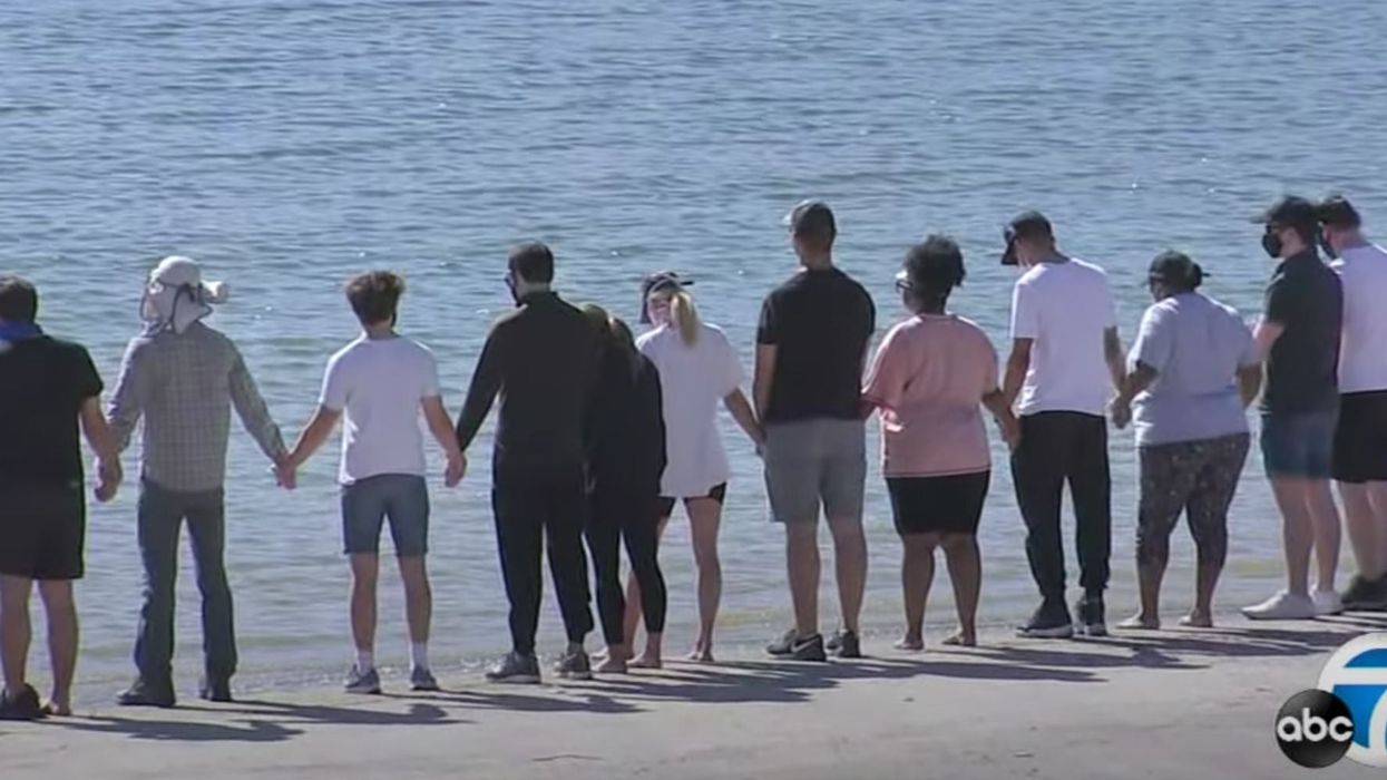 Glee cast filmed holding hands by the lake where co-star Naya Rivera died