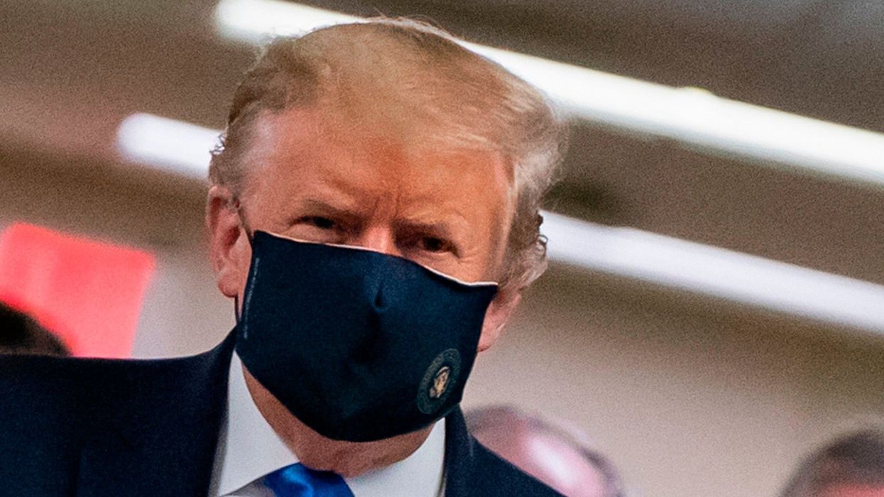 Trump branded a 'loser' for finally wearing a mask after thousands have already died