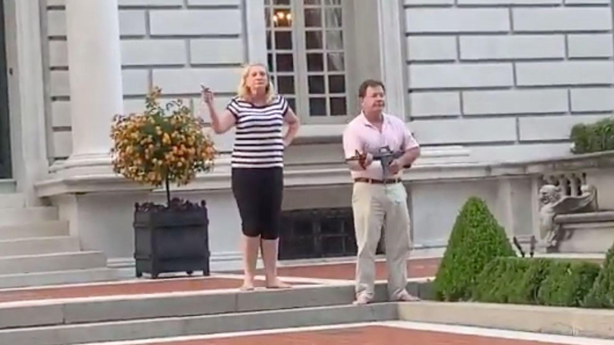 Disturbing footage shows white couple pointing guns at peaceful Black Lives Matter protesters in Missouri