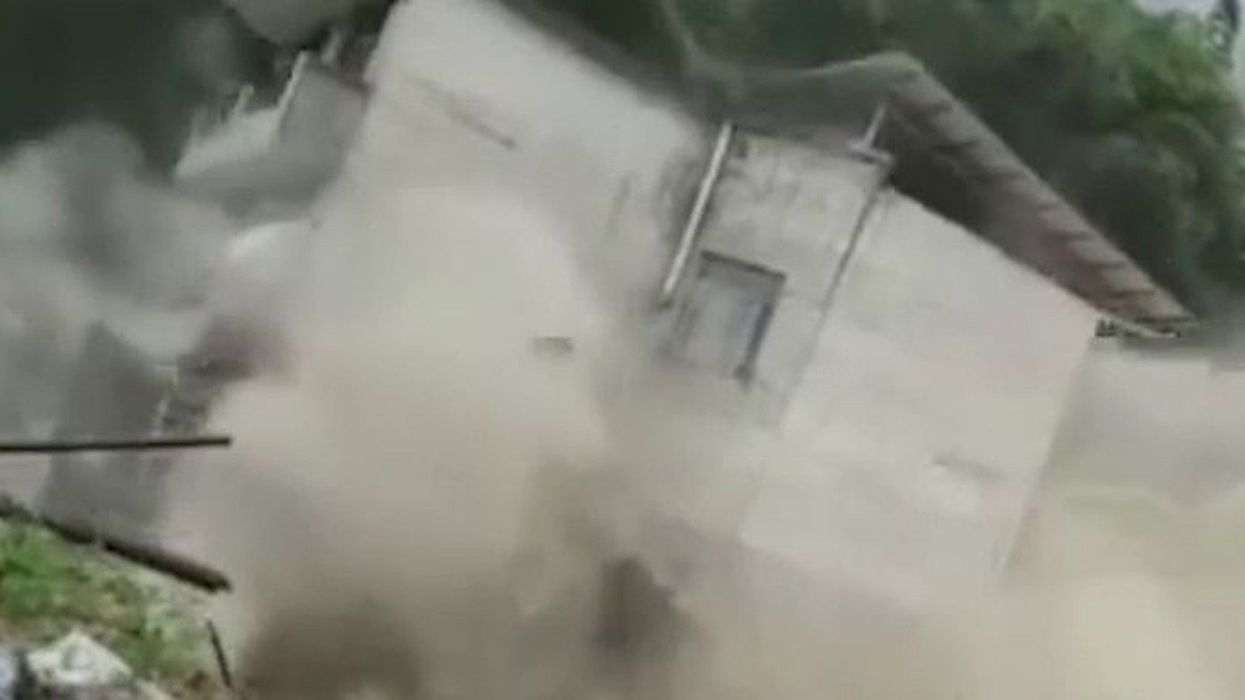 Watch the exact moment a house collapses into a Chinese river in seconds