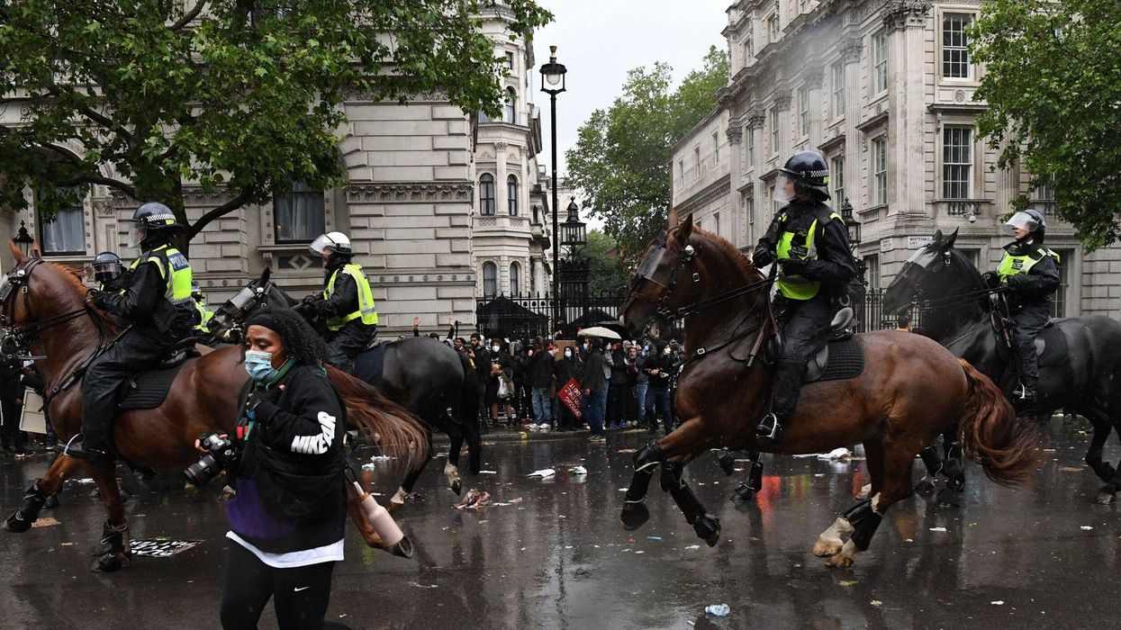 Footage of horse-mounted police officer being flung to the ground after ‘charging’ towards protesters divides people