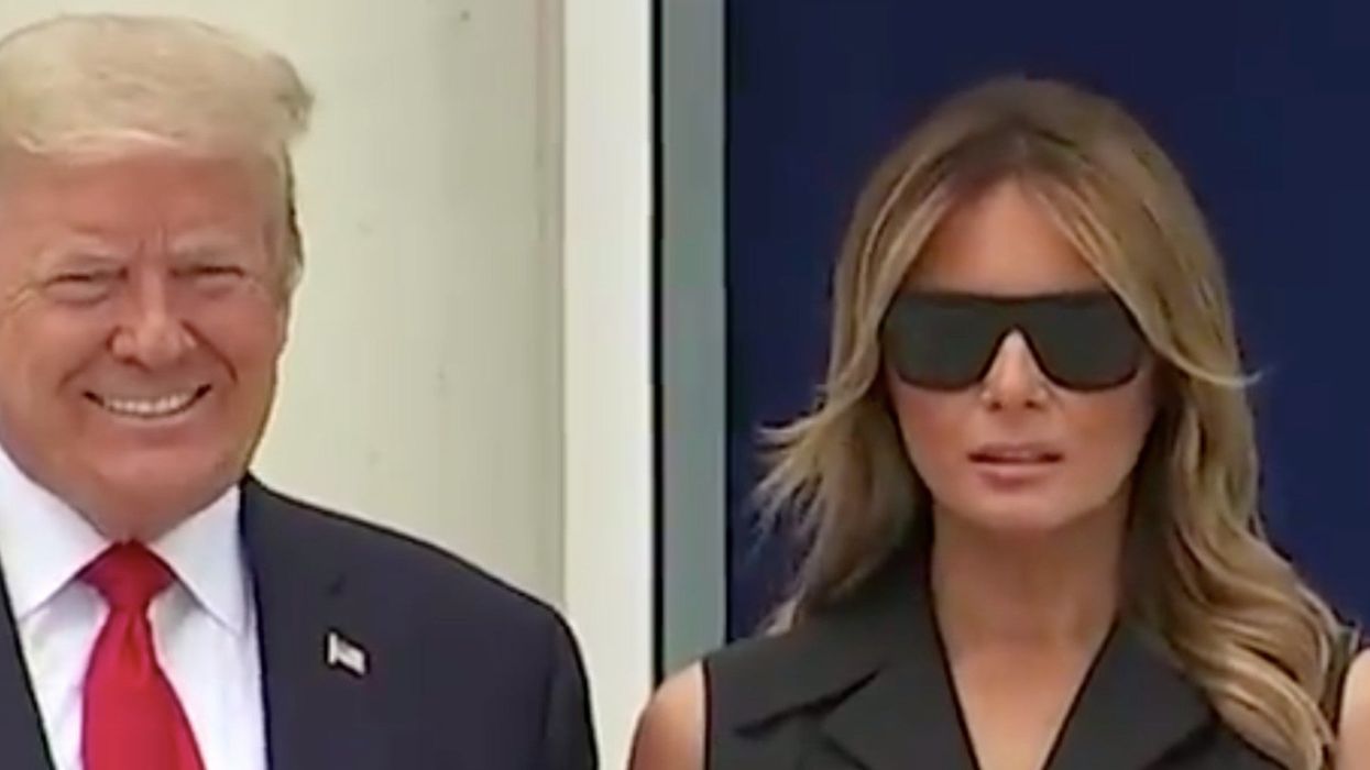 Trump appeared to ask Melania to smile but she could only grimace