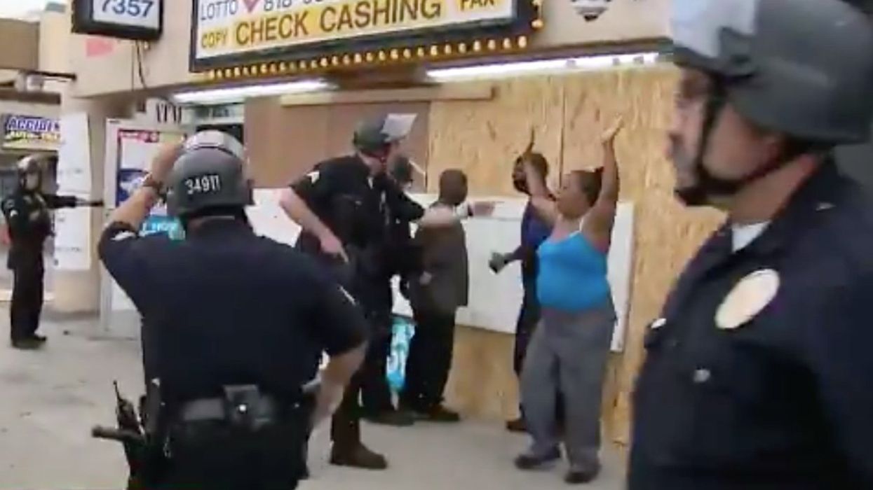 This black family tried to protect a store from looters. Armed police arrested them on live TV