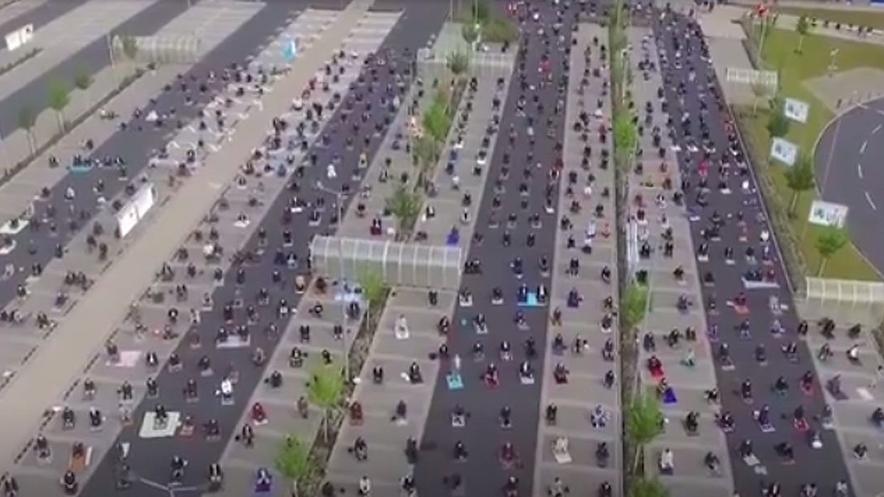 Incredible images show Muslims using an IKEA parking lot to pray safely while social distancing