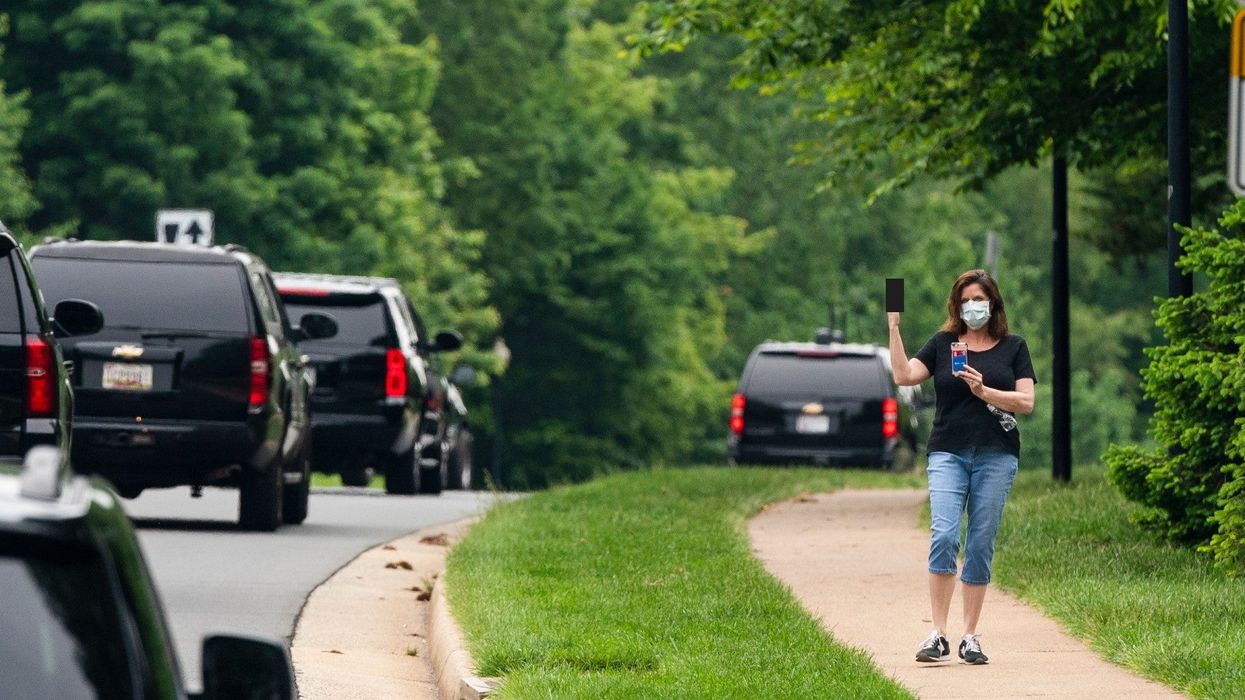 Woman hailed as a 'hero' after giving Trump motorcade the middle finger
