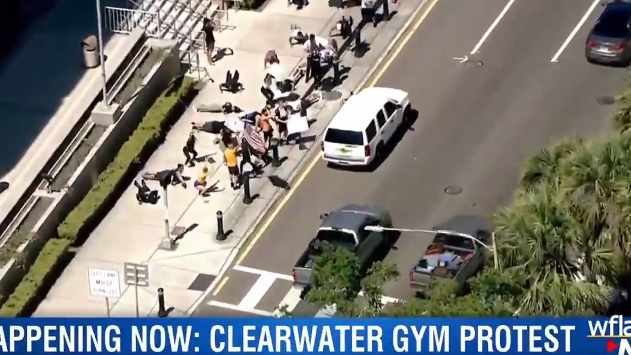 Fitness fanatics in Florida protest gym closures by angrily exercising together outside courthouse