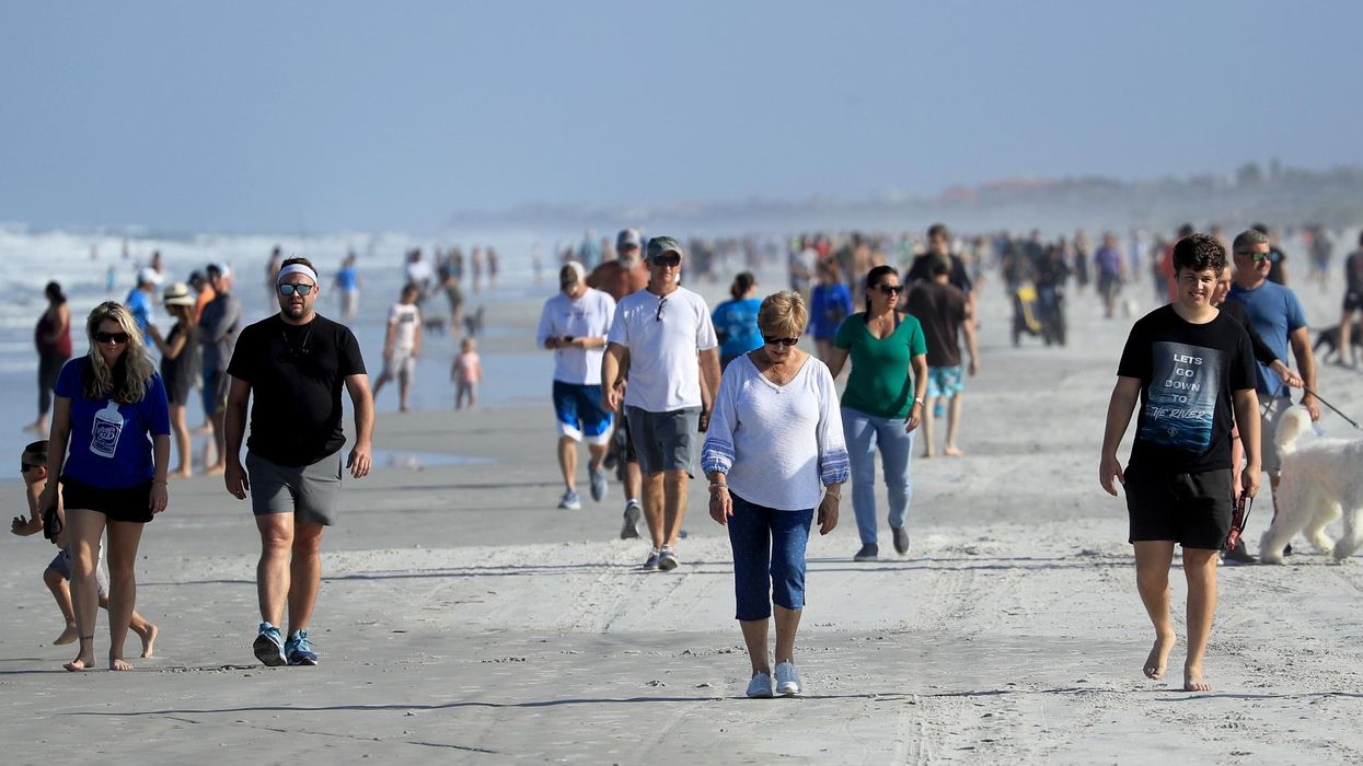 Florida beach swamped by huge crowds of people as sunshine state hits record number of new cases