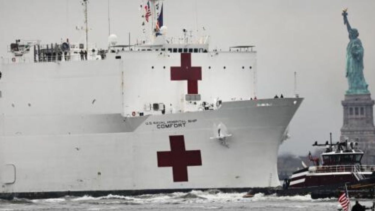 New Yorkers respond to hospital ship arriving to help deal with coronavirus by gathering in huge crowds to watch it