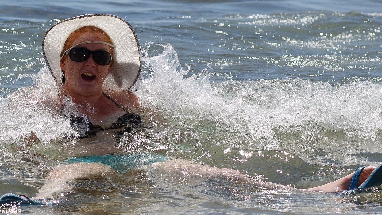 Woman says she would be 'happy to die for a day at the beach' in bizarre radio call about coronavirus lockdown