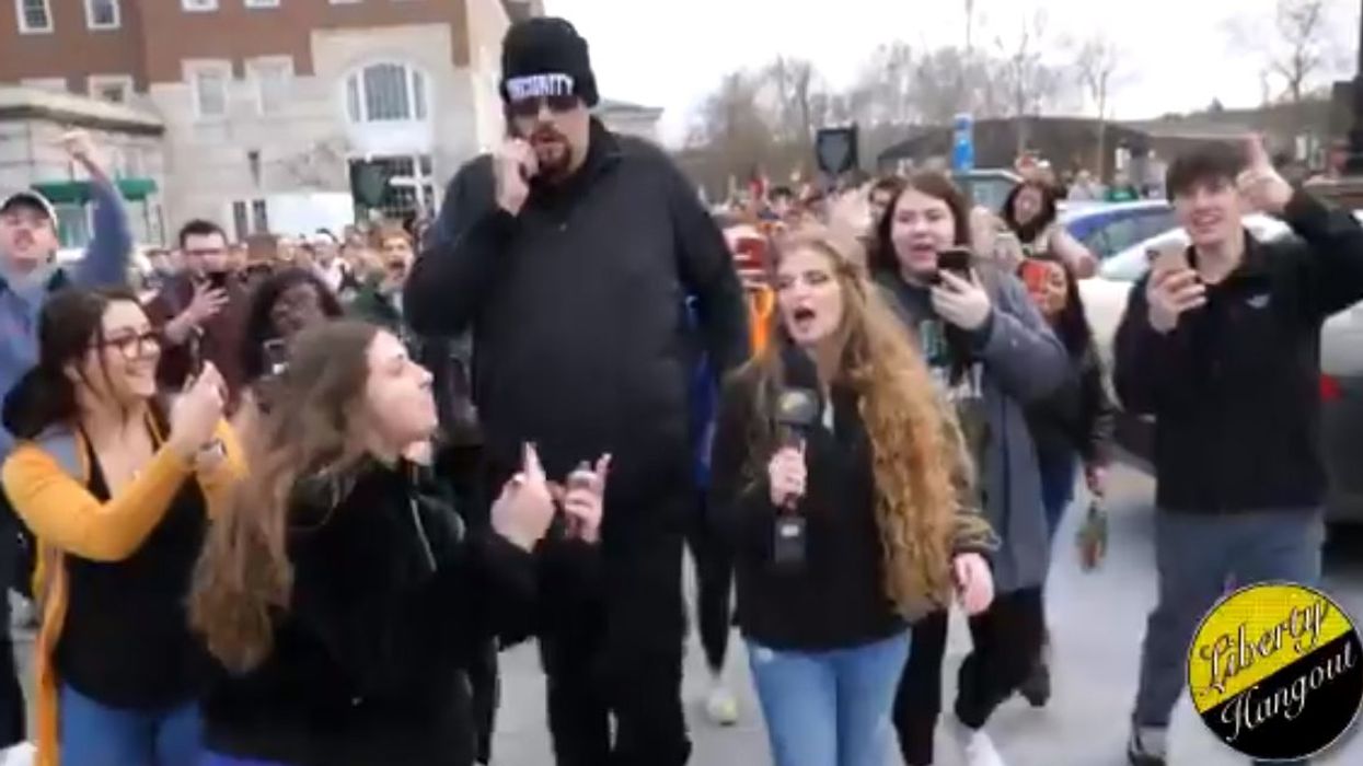 'Gun girl' mocked and chased out of Ohio University by hundreds of students