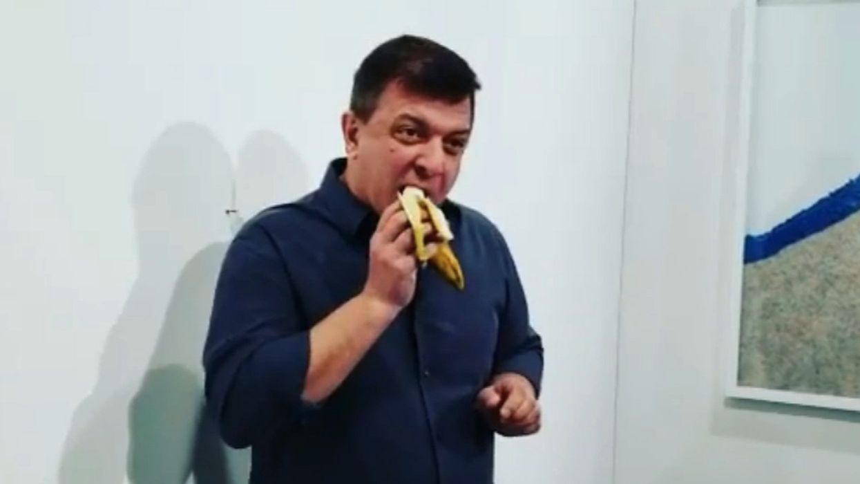 Art collector buys banana duct taped to a wall for $120,000 but then a performance artist just ate it