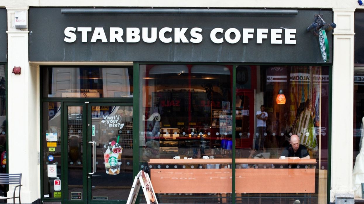 White ex-Starbucks manager who had two black men arrested sues company for racial discrimination after being fired