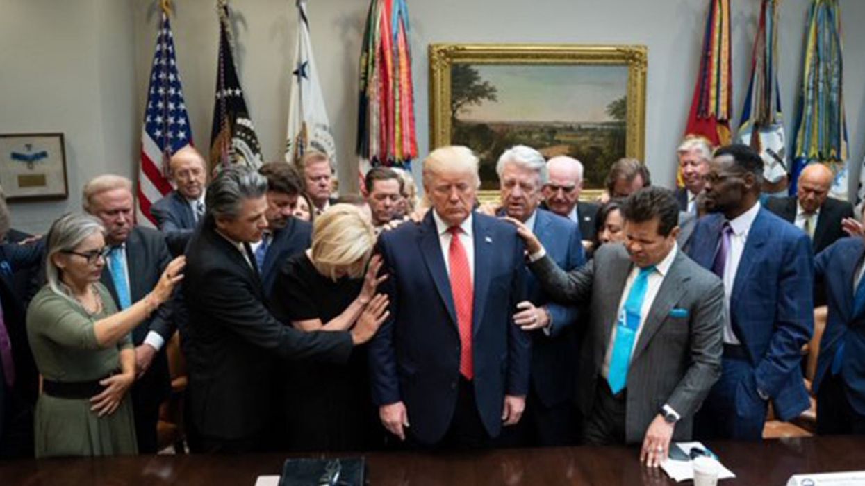 This photo of faith leaders praying for Trump has become an instant meme